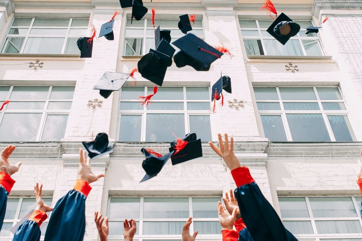 graduating student throwing